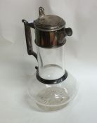A Victorian silver mounted hinged top lemonade jug
