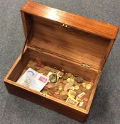 An old box containing copper and other pennie
