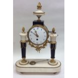 A French mantle clock with white enamel dial on ov