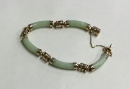 A 14 carat jade bracelet with concealed clasp and