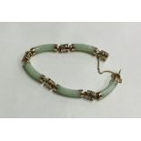 A 14 carat jade bracelet with concealed clasp and