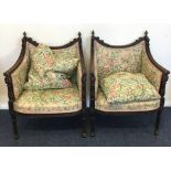 A pair of Continental armchairs with carved decora