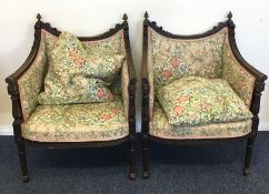 A pair of Continental armchairs with carved decora