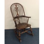 A 20th Century bow back rocking chair. Est. £40 -