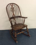 A 20th Century bow back rocking chair. Est. £40 -