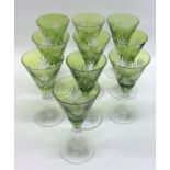 An attractive set of ten green cut glasses with fl