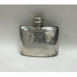 A hinged top kidney shaped silver hip flask with s