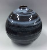A stylish pottery baluster shaped vase in blue gro