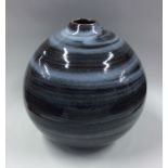 A stylish pottery baluster shaped vase in blue gro