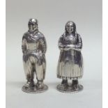 A pair of Continental silver peppers in the form o
