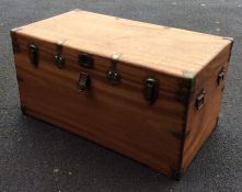 A hinged top camphor wood trunk mounted with carry