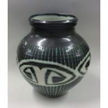 RAY MARSHALL: A green ground pottery vase of balus