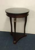 An attractive mahogany circular occasional table o