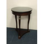 An attractive mahogany circular occasional table o