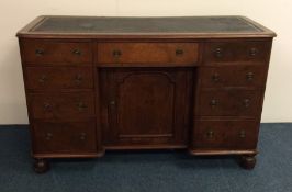 A Georgian mahogany twin pedestal desk on bracket