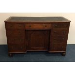 A Georgian mahogany twin pedestal desk on bracket