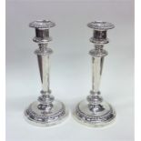 A good pair of Georgian silver candlesticks with r