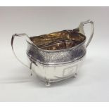 A good quality Georgian silver sugar bowl with flo