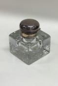 An Edwardian cut glass rectangular inkwell with si