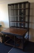 An unusual postmaster's desk with swing seat and s