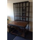 An unusual postmaster's desk with swing seat and s