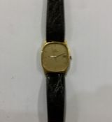 OMEGA: A gent's slim 18 carat gold wristwatch on l