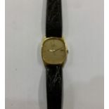 OMEGA: A gent's slim 18 carat gold wristwatch on l