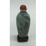 A miniature Chinese scent bottle decorated with fi