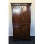 A mahogany two door wardrobe on bracket feet. Est.