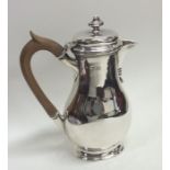 An Edwardian silver baluster shaped slim water jug