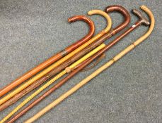 A group of silver mounted and other walking canes.