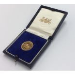 A 1966 Rhodesia £1 gold coin. Est. £200 - £300.