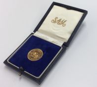 A 1966 Rhodesia £1 gold coin. Est. £200 - £300.