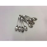 A set of six silver teaspoons together with other