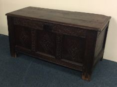 A Georgian oak hinged top coffer with panelled fro