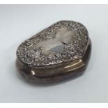 An embossed silver heart shaped box decorated with