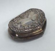 An embossed silver heart shaped box decorated with