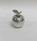 A small silver pill box in the form of an apple. L