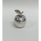 A small silver pill box in the form of an apple. L