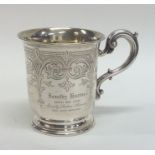 A Victorian silver christening cup decorated with