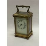 A good brass mounted carriage clock with fluted co