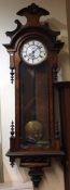 A walnut and ebony wall clock with white enamel di