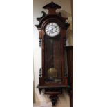 A walnut and ebony wall clock with white enamel di