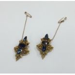 A pair of high carat gold clip earrings decorated