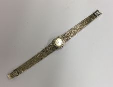 A lady's 14 carat gold wristwatch. By Ebel. Approx
