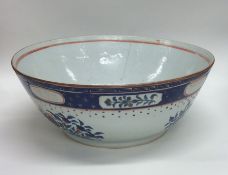 A Chinese bowl decorated with flowers and leaves t