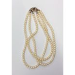 A good triple sting of pearl beads with gold and g
