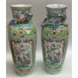 A pair of Chinese vases decorated in bright flower