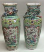 A pair of Chinese vases decorated in bright flower