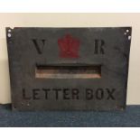 A Victorian 'V R' cast letter box plaque with crow